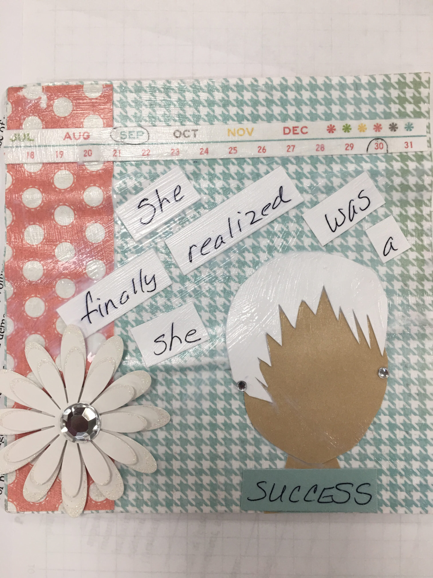 A participant's collage reading 'She finally realized she was a success' with a paper-cut face.