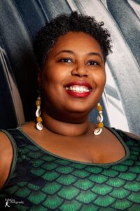 Headshot of Heard teaching artist Chè Monique.